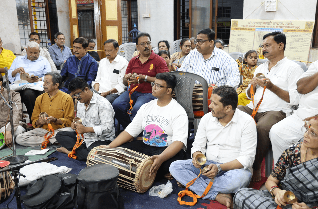 Community members performing devotional music