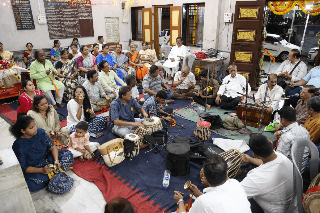 Bhajan gathering with harmonium and percussion instruments