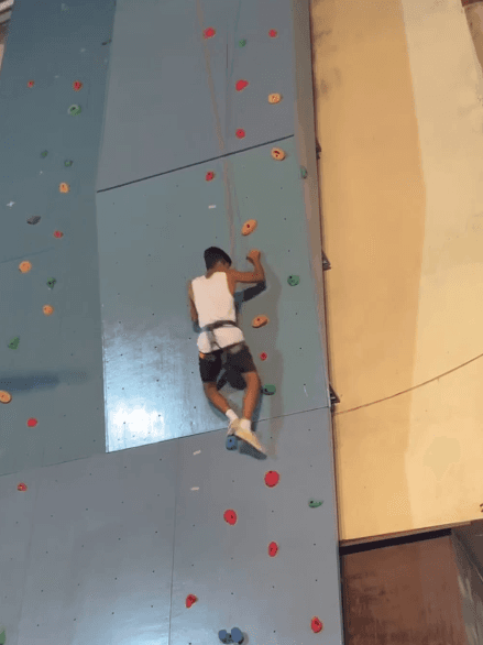 Climber practising on an indoor wall
